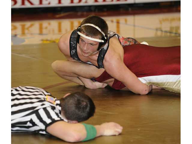 Late-match pins carry Doggs past Mill Creek