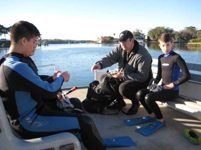 Swimming in the deep blue sea with manatees