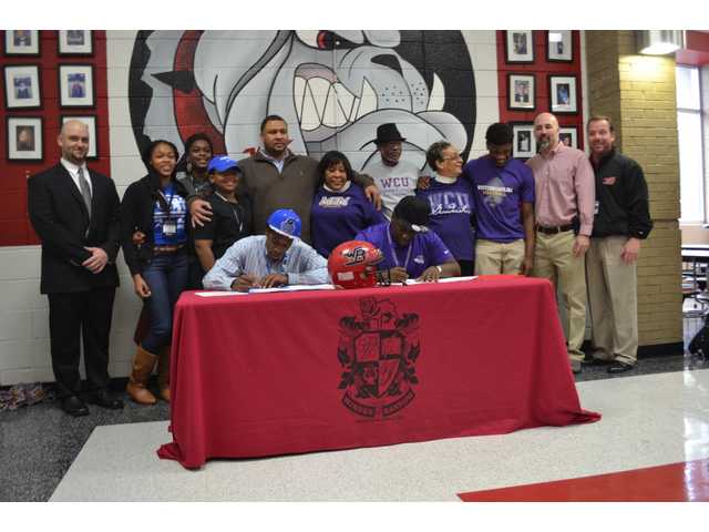 WBHS football seniors Sullivan, Junius sign WBHS football seniors Sullivan, Junius sign