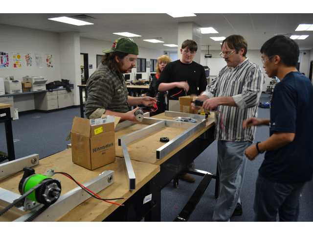Robotics Club works to create a robot that can play catch Robotics Club works to create a robot that can play catch
