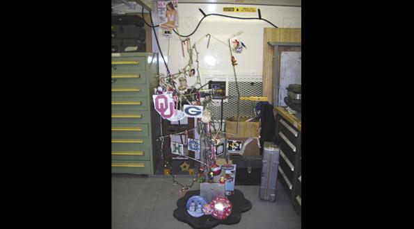 Due to the lack of suitable Christmas tree specimens in Afghanistan, B Co 603rd ASB had to make do with what they had: Hydraulic line, a printer and goodies/decorations from home.  (courtesy Staff Sgt. Paul Ramus)