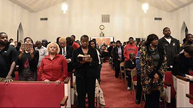 Packed crowd at prayer vigil for Glass family
