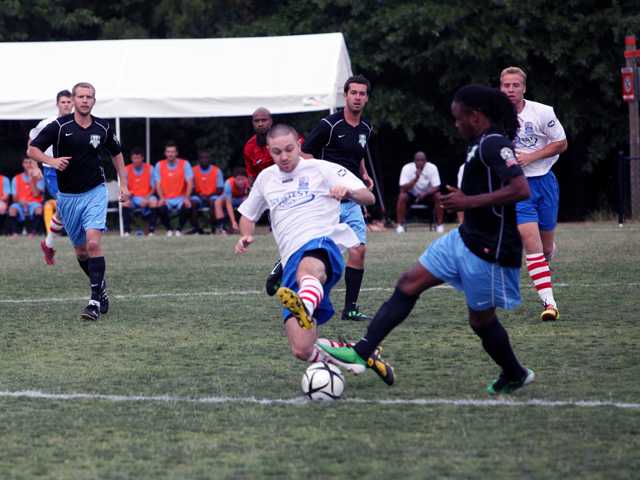 Revolution wins first game, 2-1