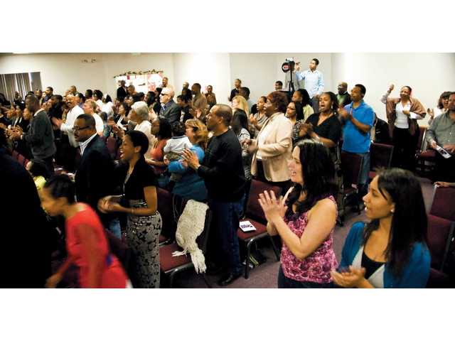 Locals inaugurate Obama with prayer