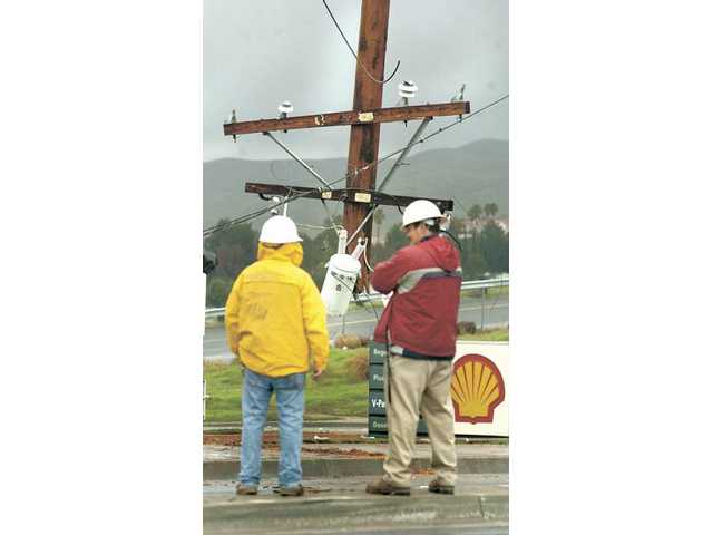 Power cut as car crashes into pole