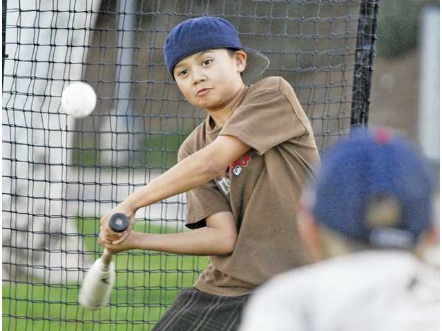 Passing time: A friendly game of wiffle ball