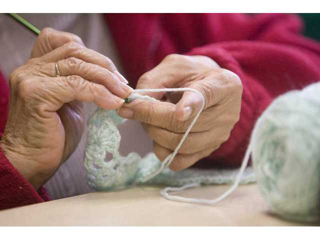 Knit together with love: craft group makes blankets for preemies