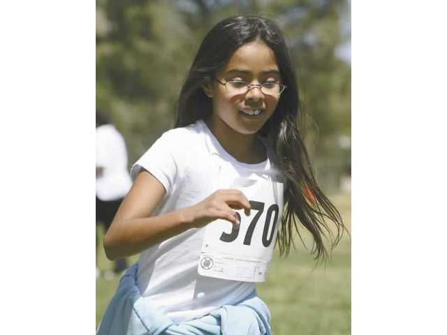 Rosedell students run with Rosie the Roadrunner
