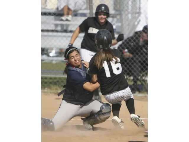 Cents softball gets it from both sides