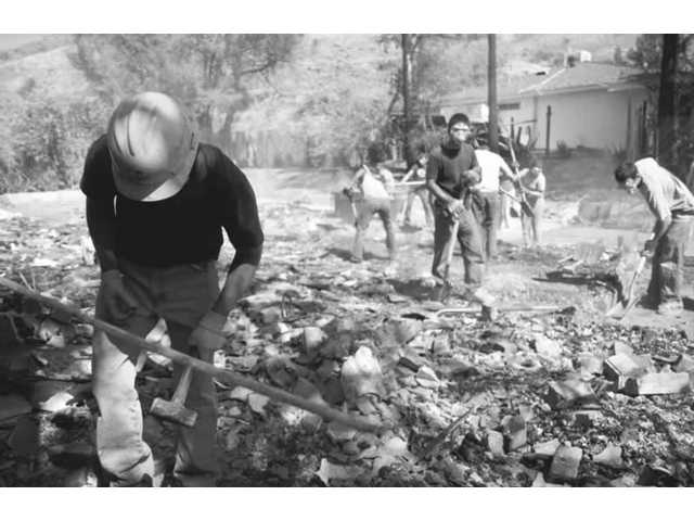Volunteers clean home sites lost to wildfires