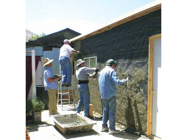 ‘Men at work’ build homes in Mexico