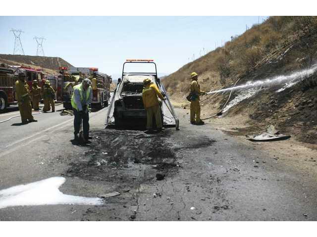 Burning car ignites grass fire 