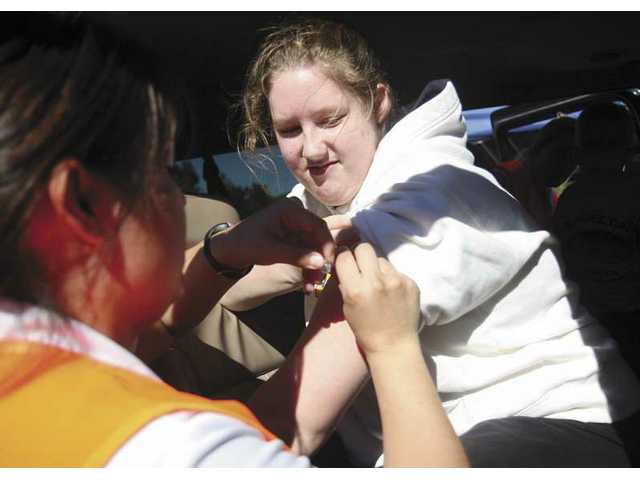 Drive-through flu shot clinic treats 1,200 people