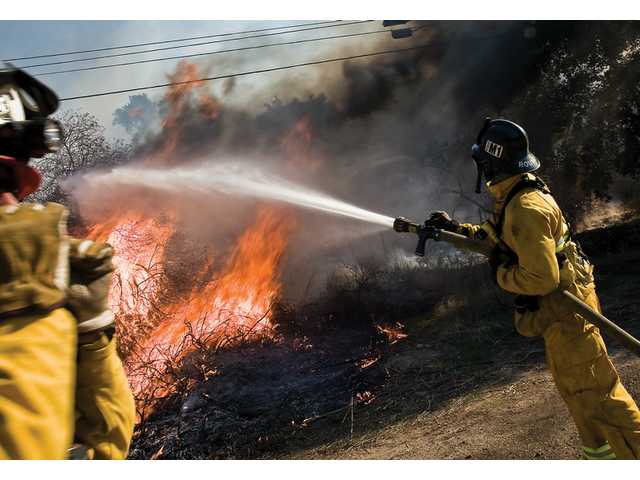 Firestorms tear into Southern California