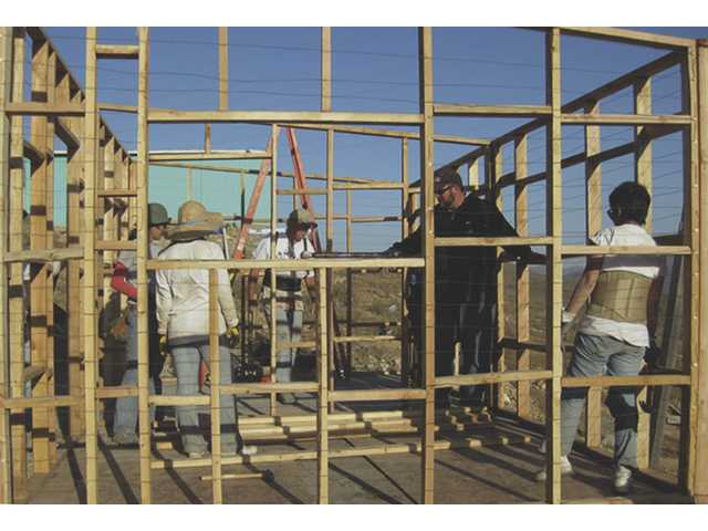 Church members build home