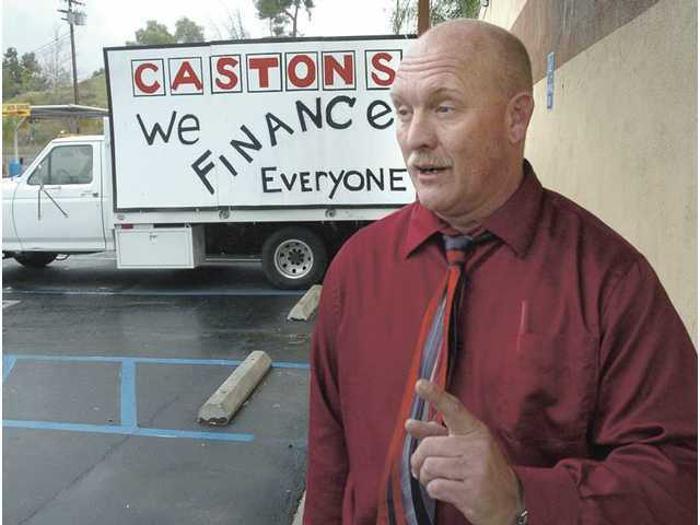 A (parking) lot of trouble: Caston’s owners cited for parking-lot sales, which city sees as blight
