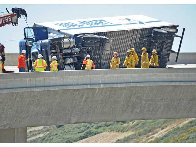 UPDATED: Overturned big-rig backs up I-5