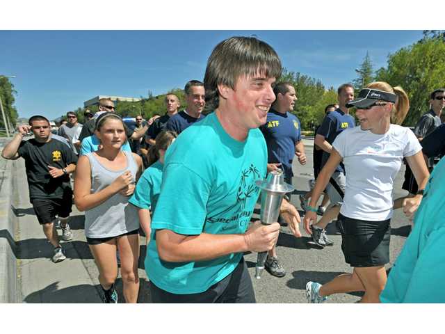 Law Enforcement Torch Run makes its way through the SCV