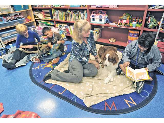 Dogs lend a paw for reading fun