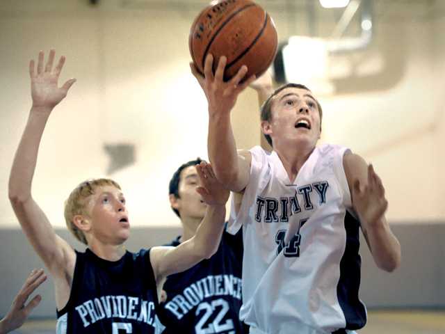 Prep basketball: Trinity halts the advances