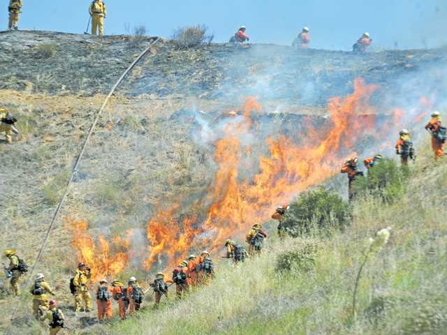 Castaic fire began  with crash