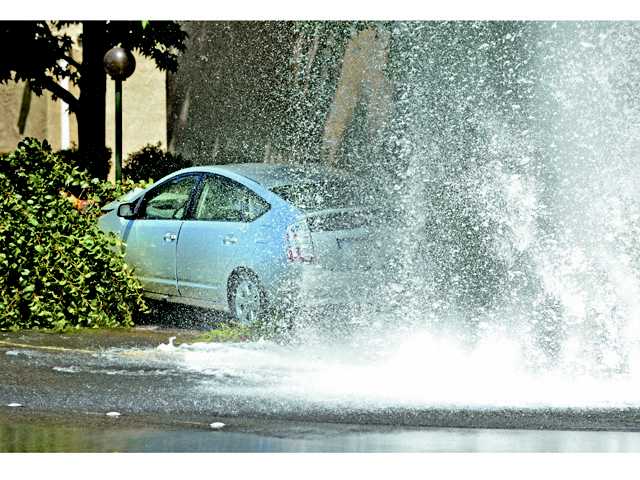 Car crashes into water hydrant