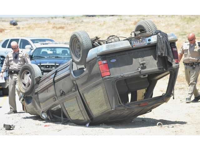 1 taken to hospital after SUV rolls over on Highway 14