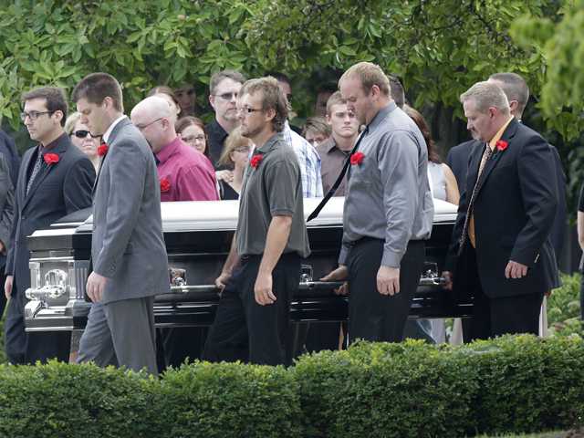 Colo. victims mourned at funerals in 3 states