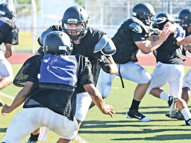 Prep football: Crossing the line