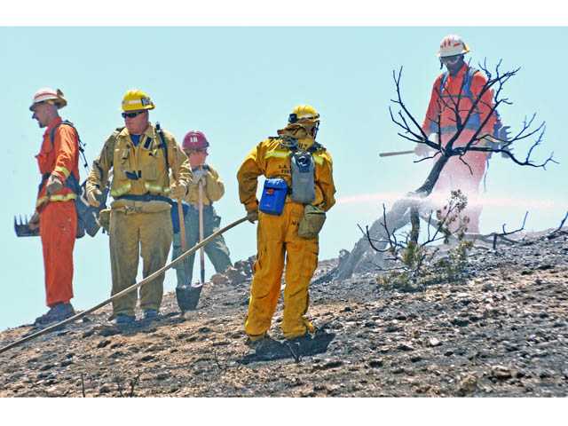 Firefighters contain Highway 14 fire