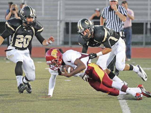 Prep football: Two through Golden Valley's fingers