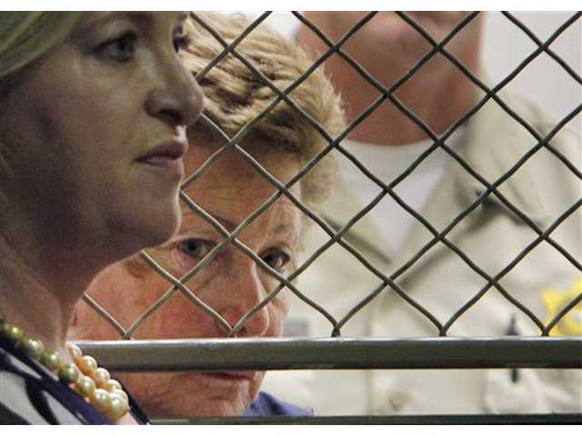 Woman charged in husband's death gives DNA sample