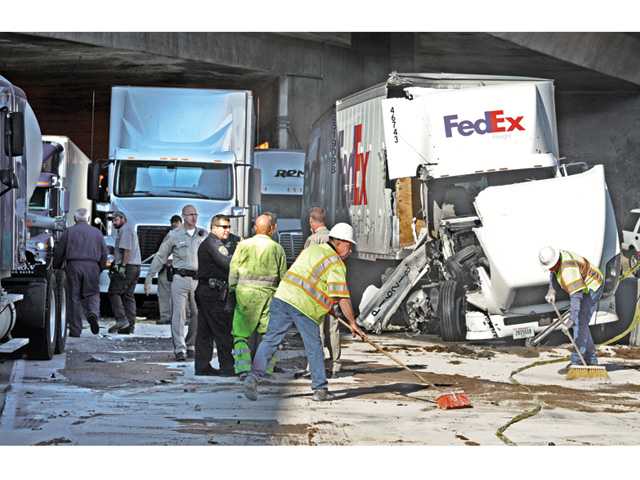 UPDATE: 9 big rigs collide in Newhall Pass truck tunnel
