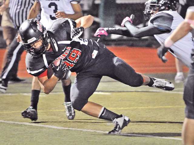 Prep football: Cardinals still alive