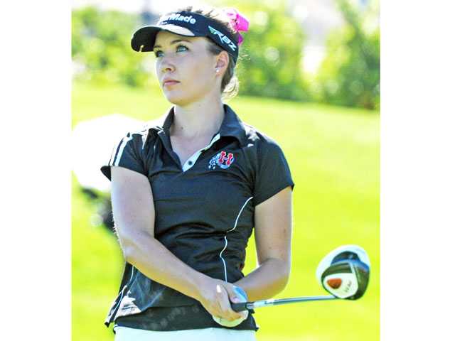 Prep golf: The look of a focused girl
