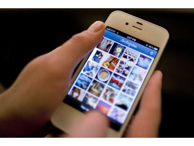 Instagram says users' photos won't appear in ads 