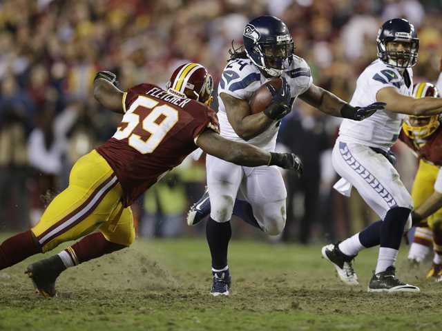 NFC wild card: RG3 hurt, Seattle tops Redskins 24-14 in playoffs  