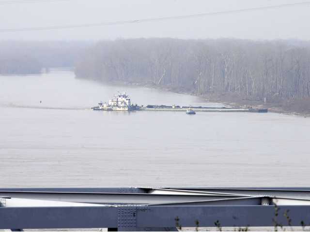 Barge with 80,000 gallons oil hits bridge, leaks