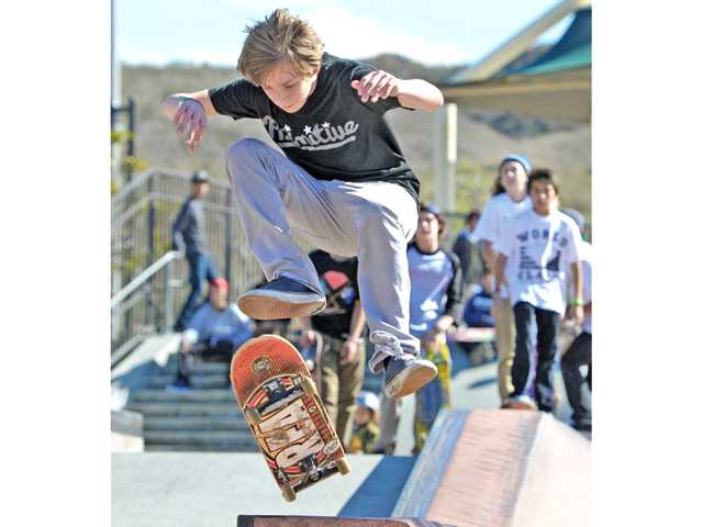 Participants flip for skateboard competition