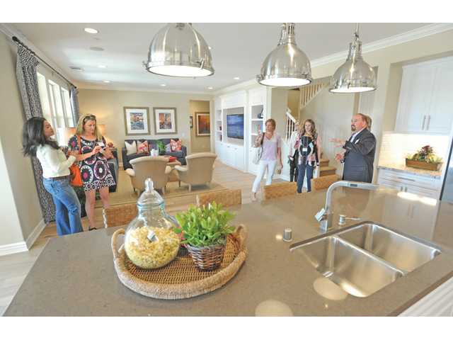 Builder debuts homes overlooking riverbed