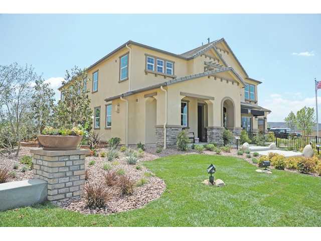 Builder debuts homes overlooking riverbed