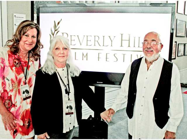 "The 13th Step" producer Monica Richardson, left, with Karla Brada's mother and father Jaroslava and Hector Mendez at the Beverly Hills Film Festival where the film won best documentary.