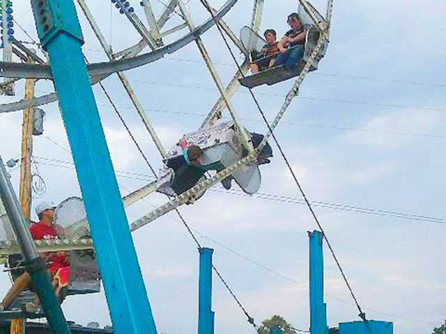 Ferris wheel cart overturns Ferris wheel cart overturns