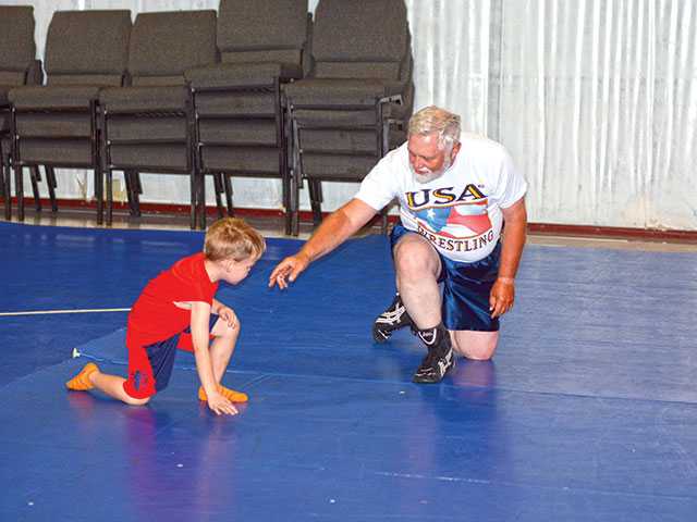 Campers grapple with wrestling lessons Campers grapple with wrestling lessons