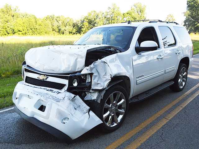 Woman pulled from burning SUV Woman pulled from burning SUV