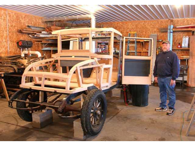 Chris Andrews reconstructs antique car’s wood frame